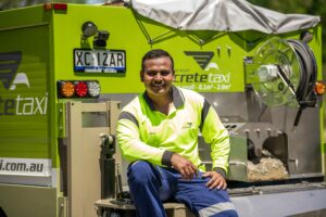 Chidananda sitting on concrete taxi truck