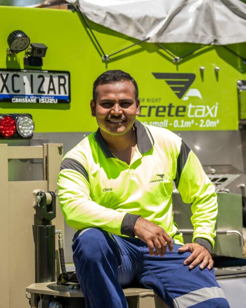 Chidananda sitting on concrete taxi truck