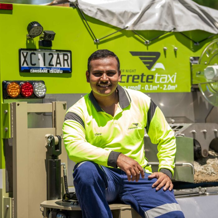 Chidananda sitting on concrete taxi truck